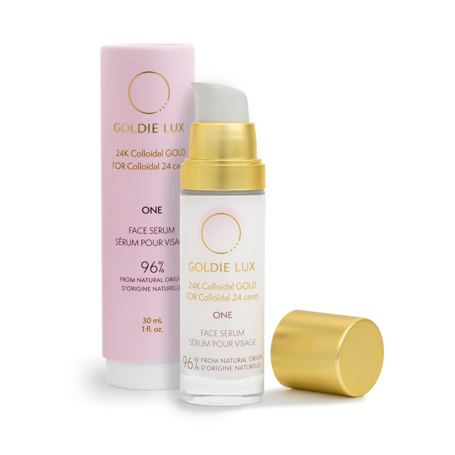 Goldie Lux | 24 Karat Colloidal Gold Face Serum 30 mL. Cap is removed from glass bottle to show pump, and the outer packaging sits behind the bottle.